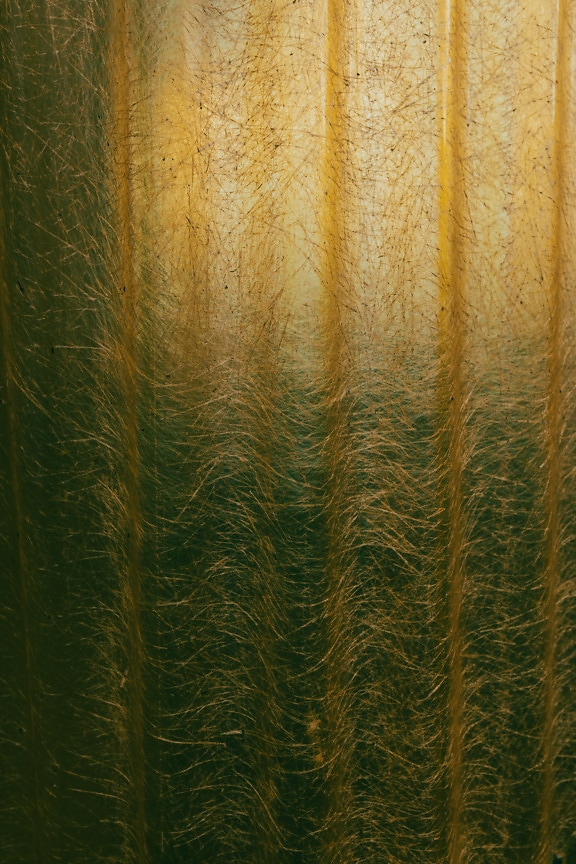 Old greenish yellow transparent plastic texture with background sunlight