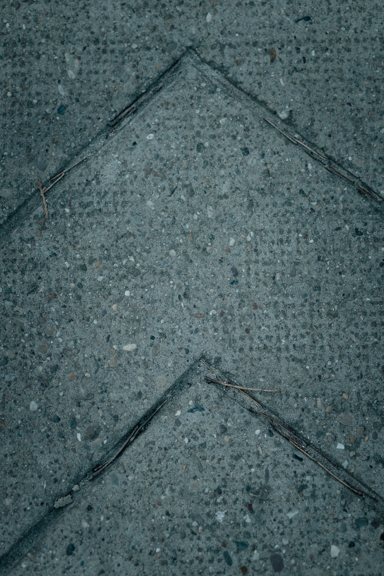 Concrete surface texture with arrow pattern