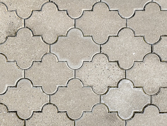 Concrete pavement with arabesque shape texture close-up