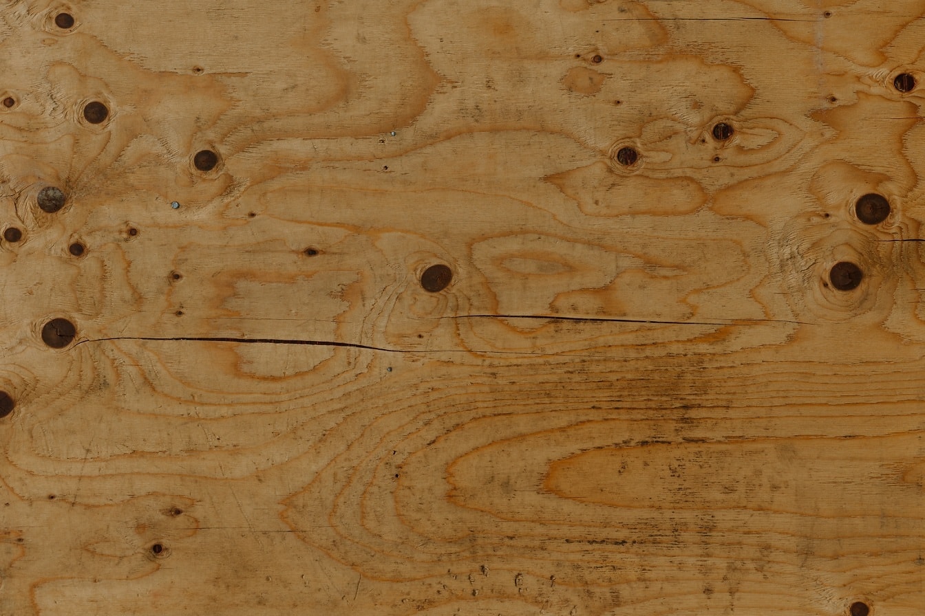 Oude rustieke bruine plank met close-up van de knooptextuur
