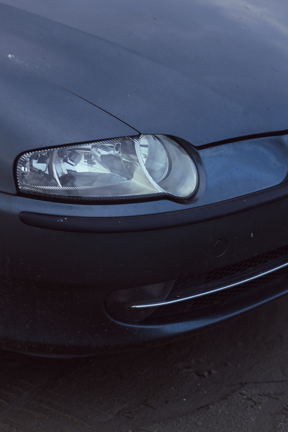 Headlights of dark blue metallic car