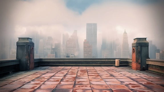 Perspective de gratte-ciel dans différentes nuances de smog depuis un toit plat
