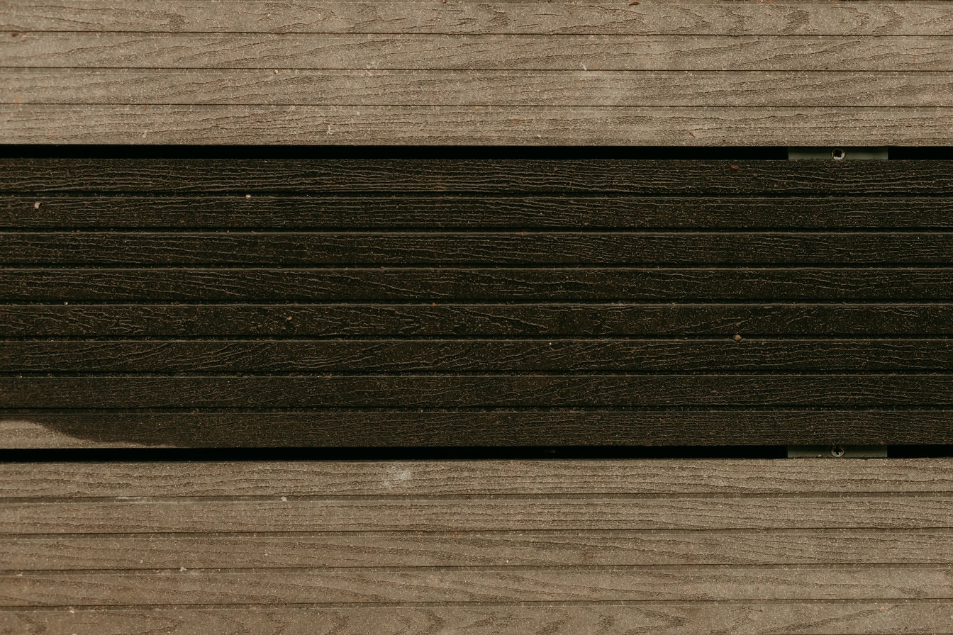 Plastikowe sztuczne jasnobrązowe drewniane deski tekstura