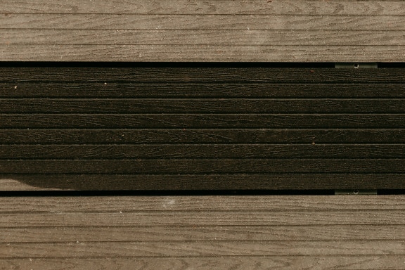 Plastic artificial light brown wooden planks texture