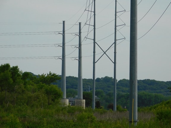 Electricity transmission high voltage pylons in hills