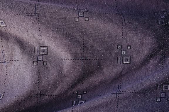 Purplish cotton canvas with geometric square pattern