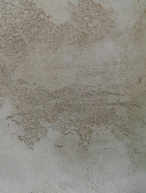 Gros plan sur la texture de la surface du ciment brun clair