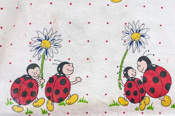 Old dirty cotton napkin with illustration of ladybug