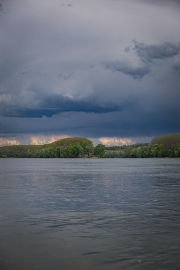 Dark blue storm clouds over Danube river