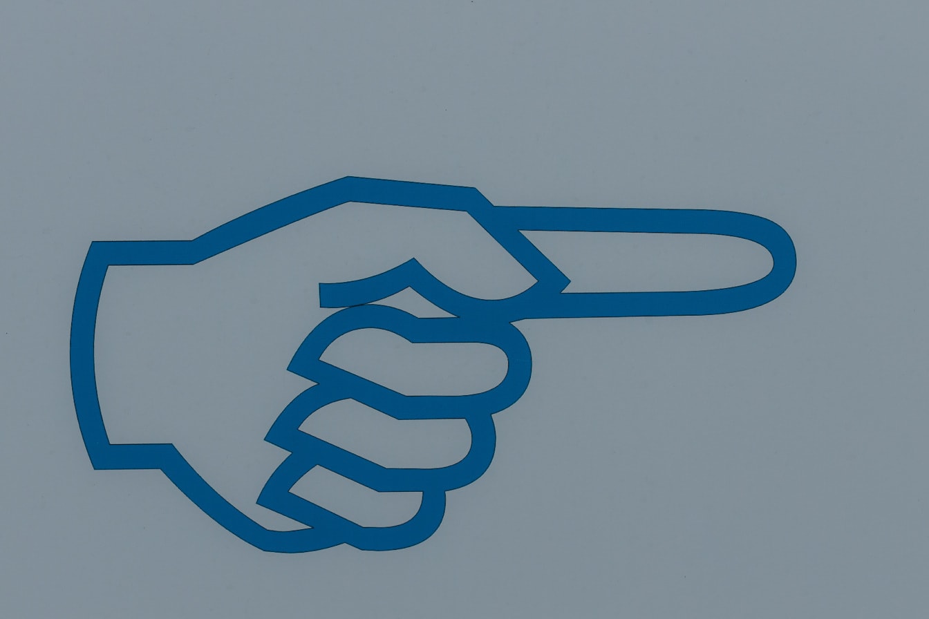 Mano blu scuro con segno di simbolo del dito nella direzione destra