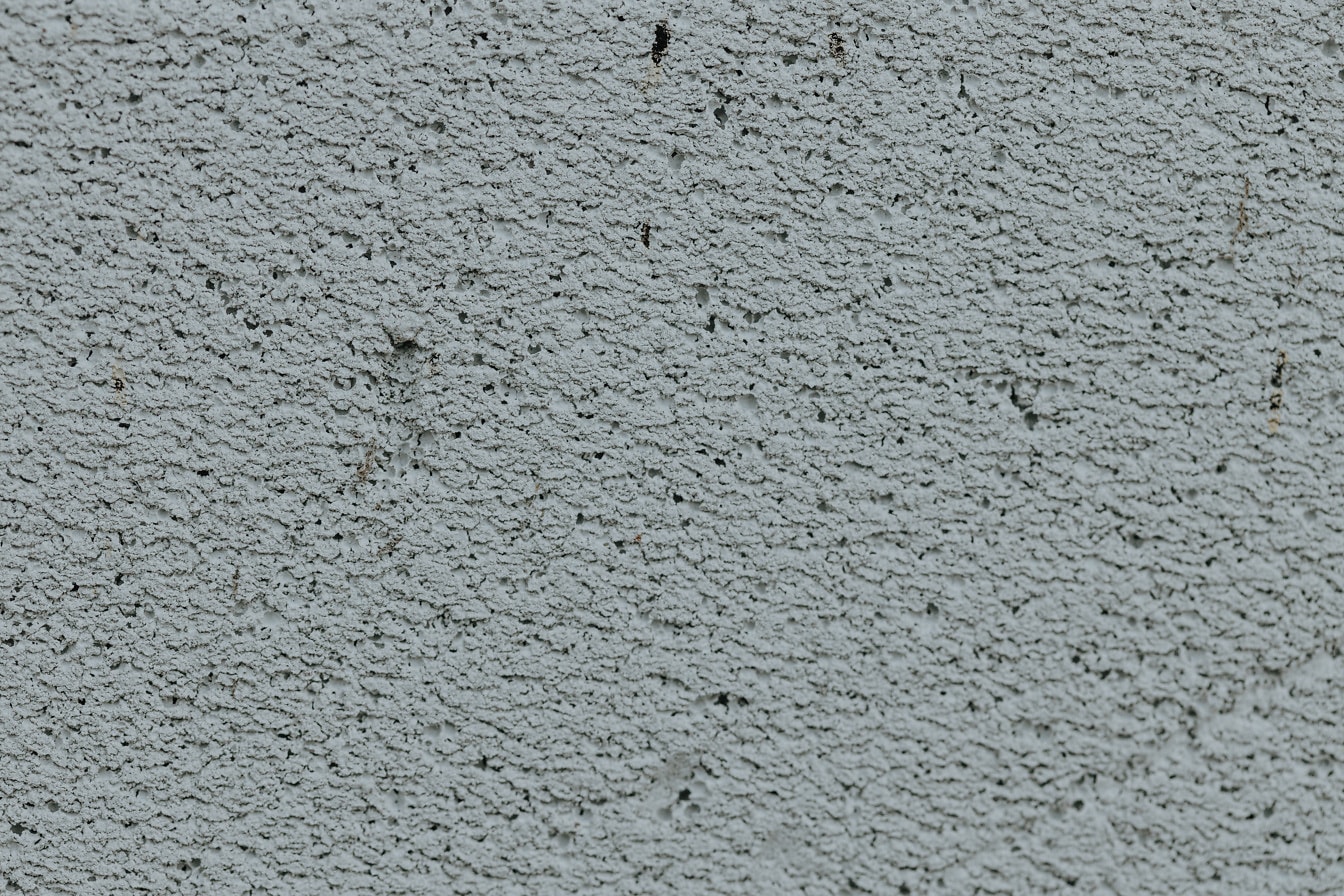Grey paint rough texture on wall close-up