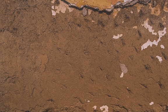 Texture di decadimento della vecchia superficie del muro di mattoni di adobe