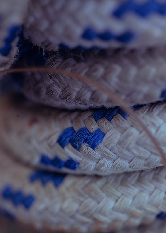 Close-up of nylon rope with white and dark blue fiber
