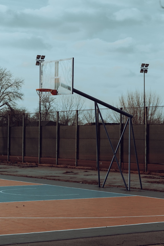 Empty basketball court in urban area