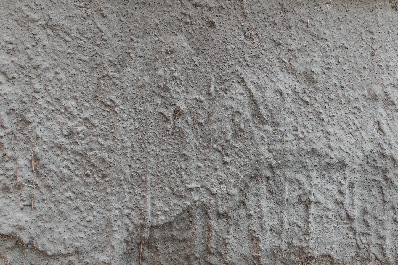 Cemento gris con textura rugosa en primer plano