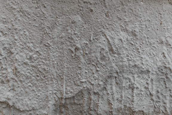 Šedý cement s drsnou povrchovou strukturou