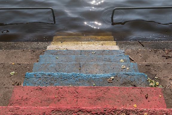 Concrete tricolor staircase with flood water