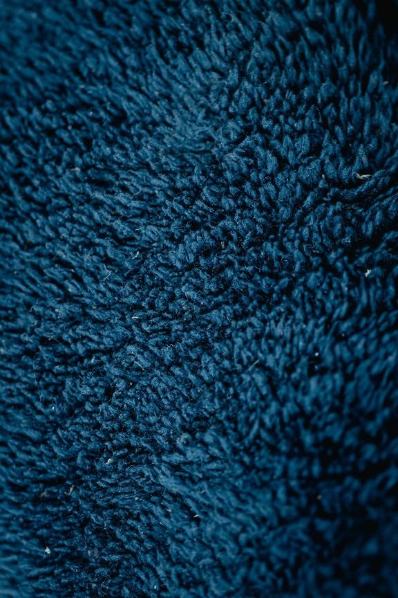 Dark blue vibrant color of wool  close-up texture
