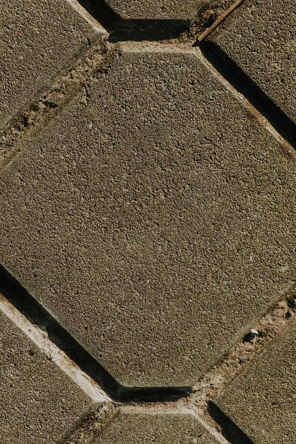 Concrete paving stone with geometric rhomb pattern close-up