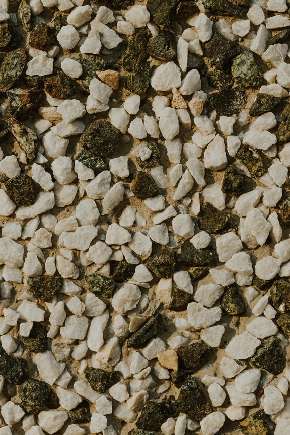 Pedras de granito preto e branco em textura close-up de cimento