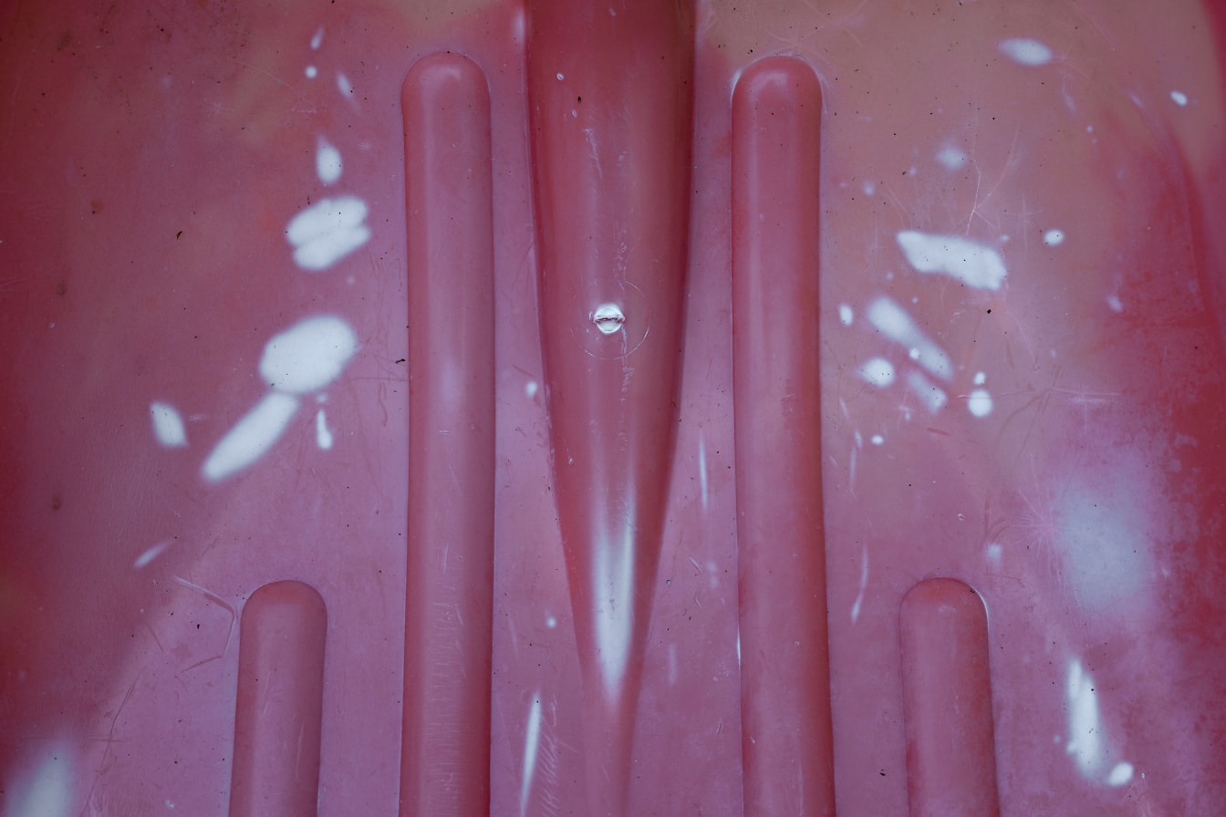 오래 된 광택 분홍빛이 도는 플라스틱 질감 클로즈업
