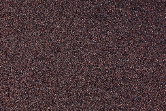 Dark purplish cement wall close-up texture