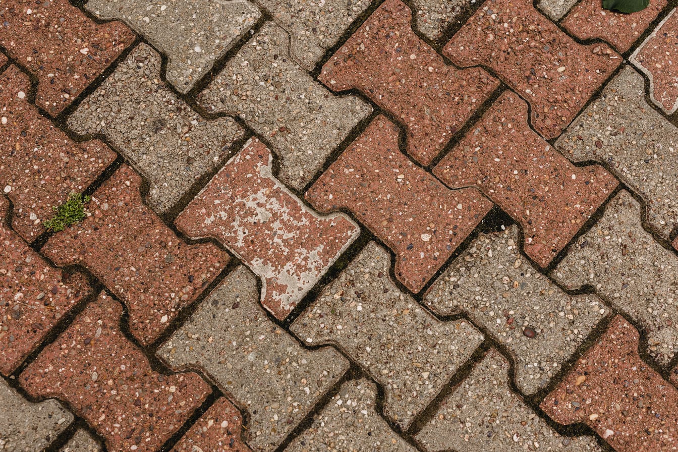 Reddish and light brown concrete paving stone texture