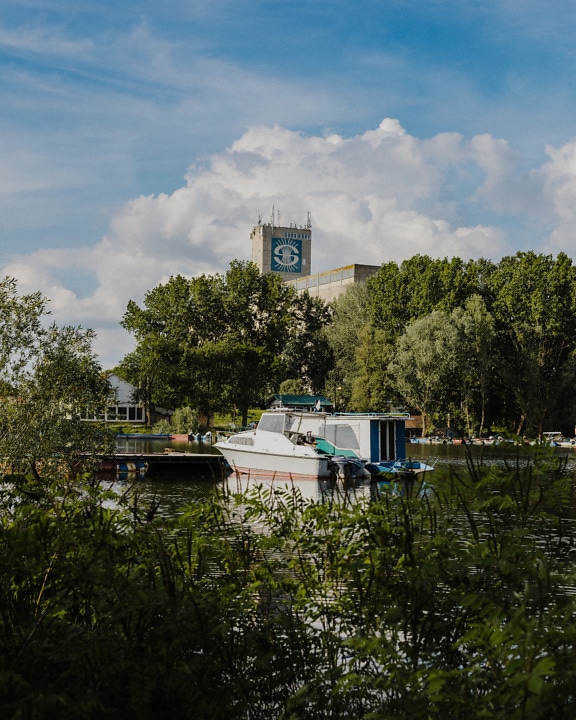 Small yacht in river harbor on Danube river