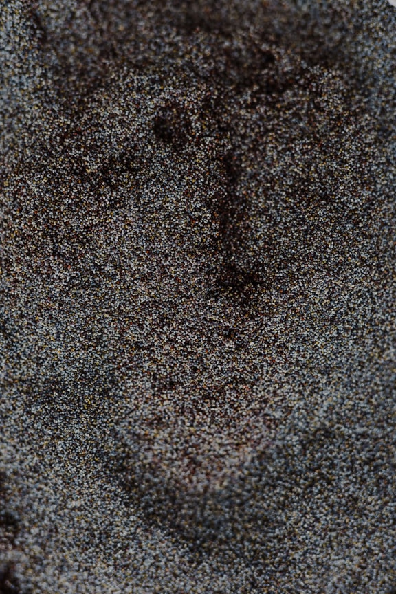 Cinza escuro textura de superfície de pedra pequena close-up