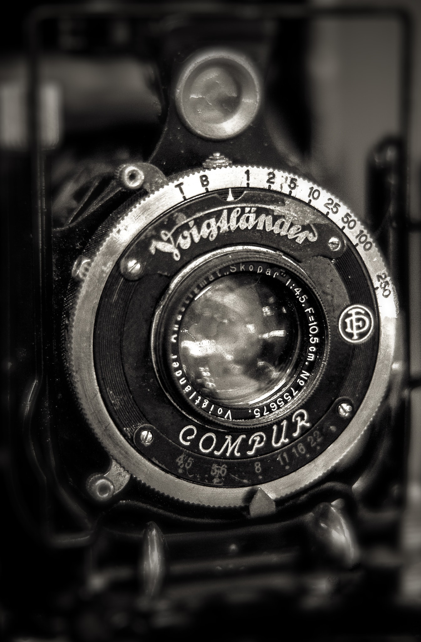 Voigtlander analogue photo camera close-up of lens monochrome