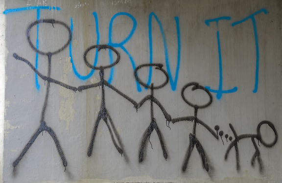 Turn It blue text graffiti with black drawings