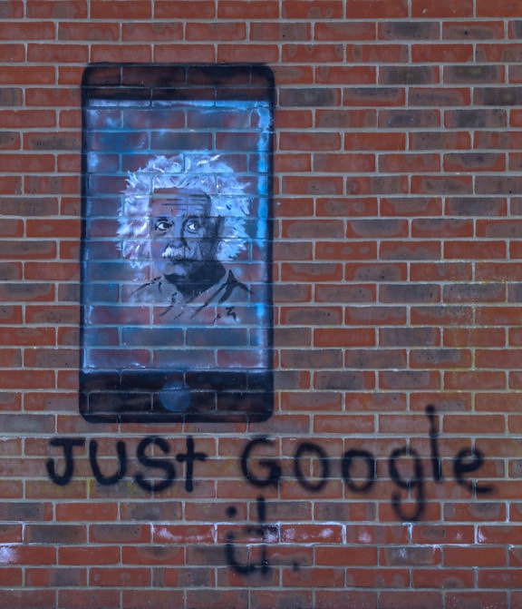 Einstein A-Go-Go graffiti with mobile phone and Just Google it text