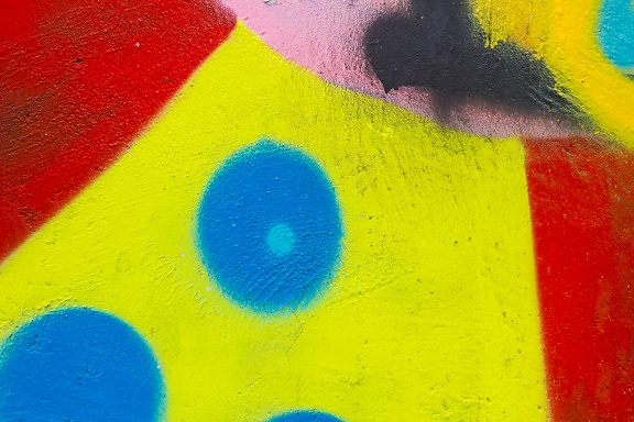 Grafite colorido vibrante abstrato no close-up da parede