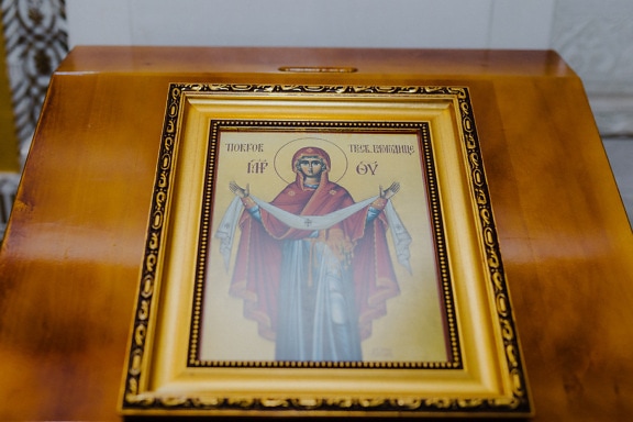 Orthodox icon of mother of Jesus Christ in golden shine frame