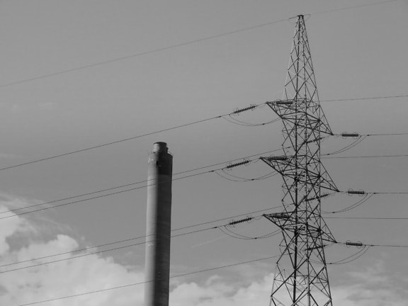 High voltage transmission pylon with wires monochrome photography