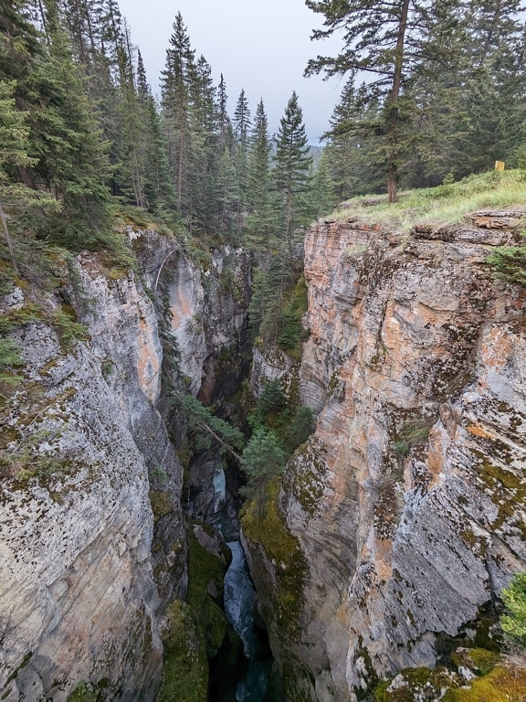 Narrow canyon formation with mountain river