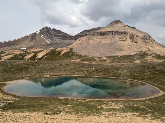 Majestic small lake at top of mountains in national park