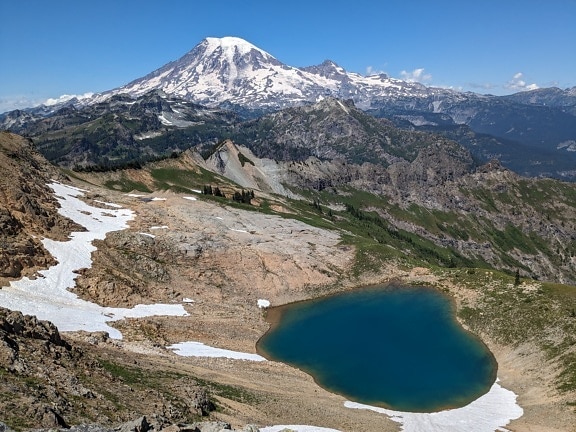 Majestic panorama of Tatoosh peak glacier lake in America national park