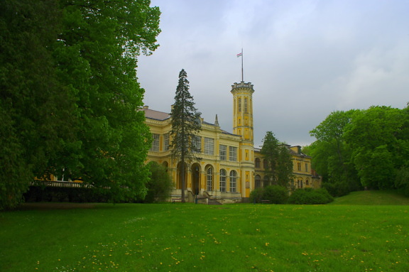 Károlyi palace castle tower in Hungary with green lawn