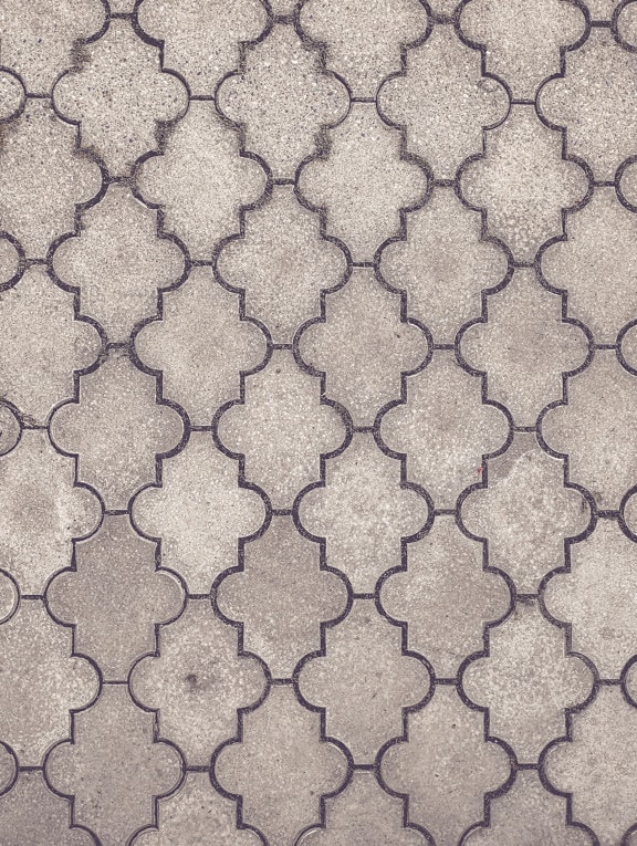 Textura suprafeței pavajului din beton gri pe sol