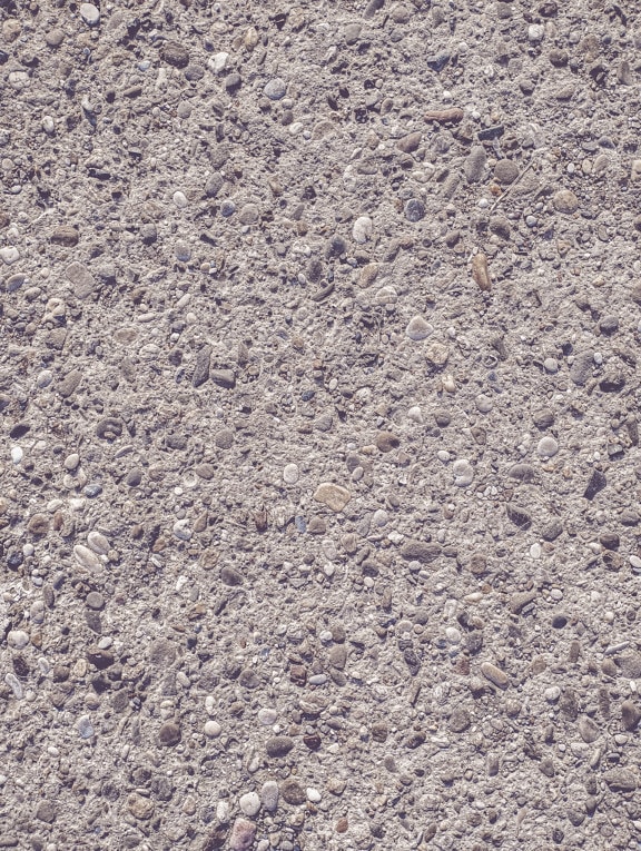Detailný záber na starú rozpadajúcu sa asfaltovú betónovú textúru