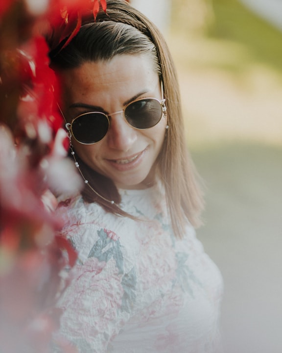 Close-up portrait of happy brunette with sunglases
