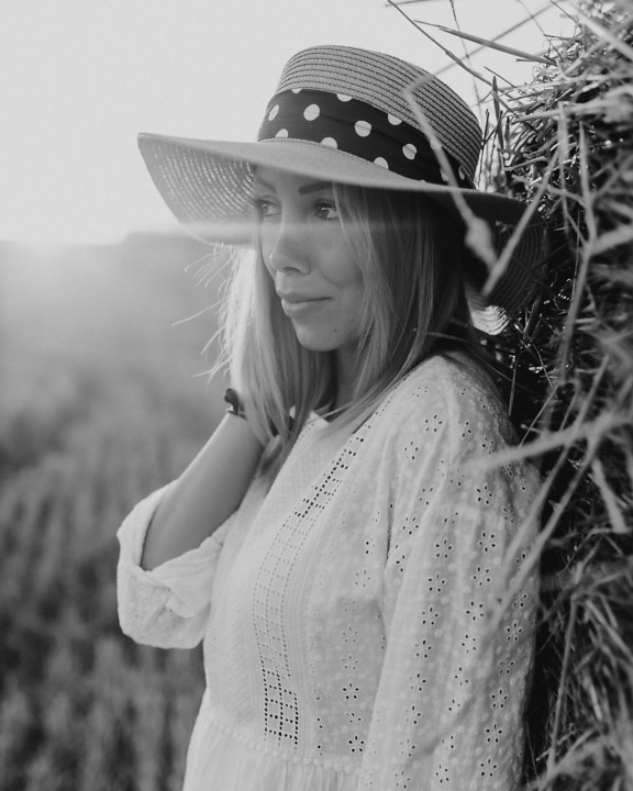 Cowboy woman with straw hat monochrome portrait