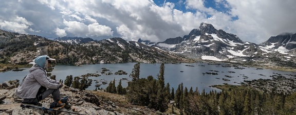 Mountain climber enjoy national park panorama from high land