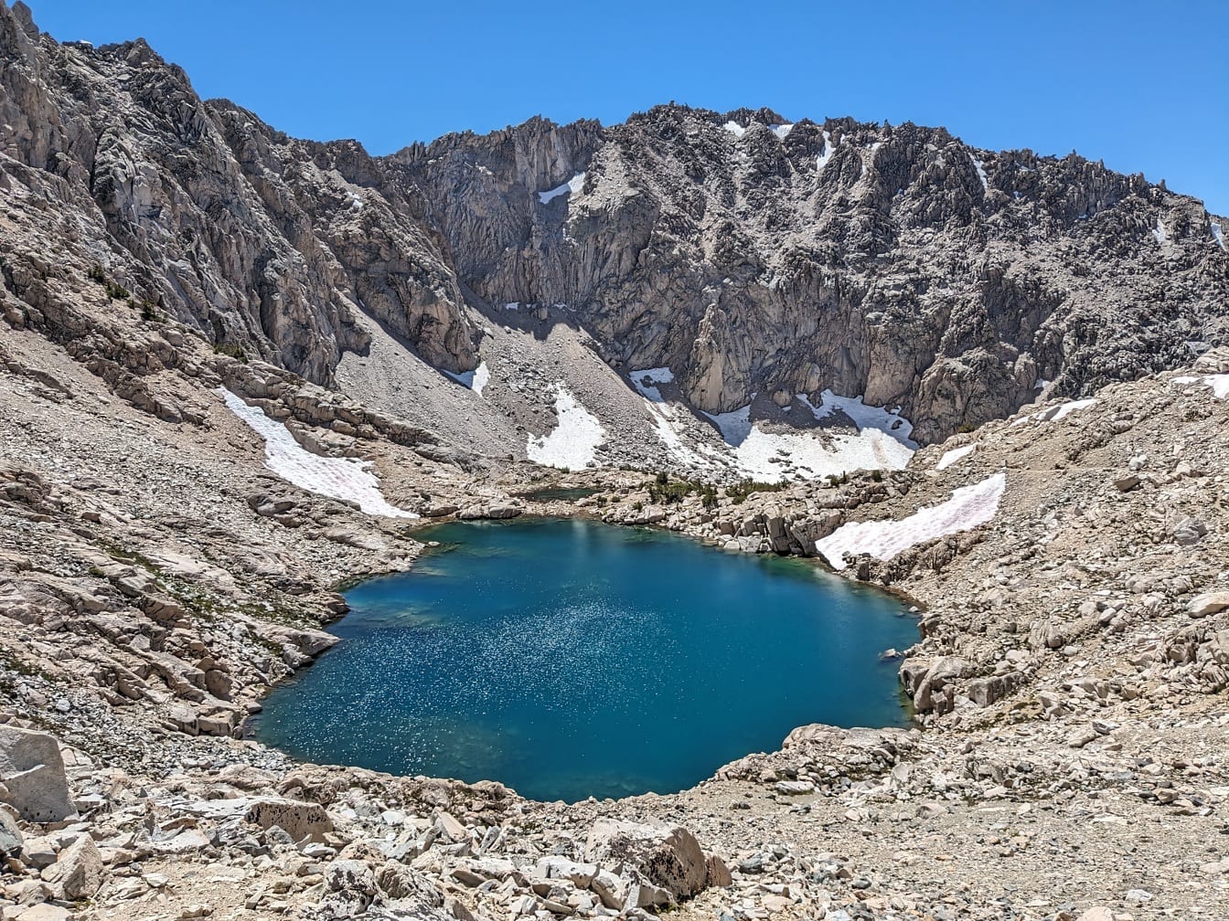 Small azure color lake in high land mountains