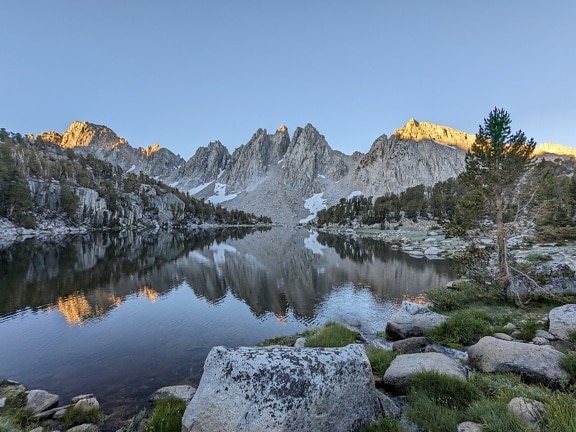 Beautiful Inyo lakeside with reflection of mountain peaks at afternoon