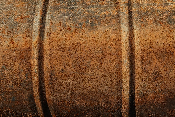 Rusty metal of oil barrel close-up texture