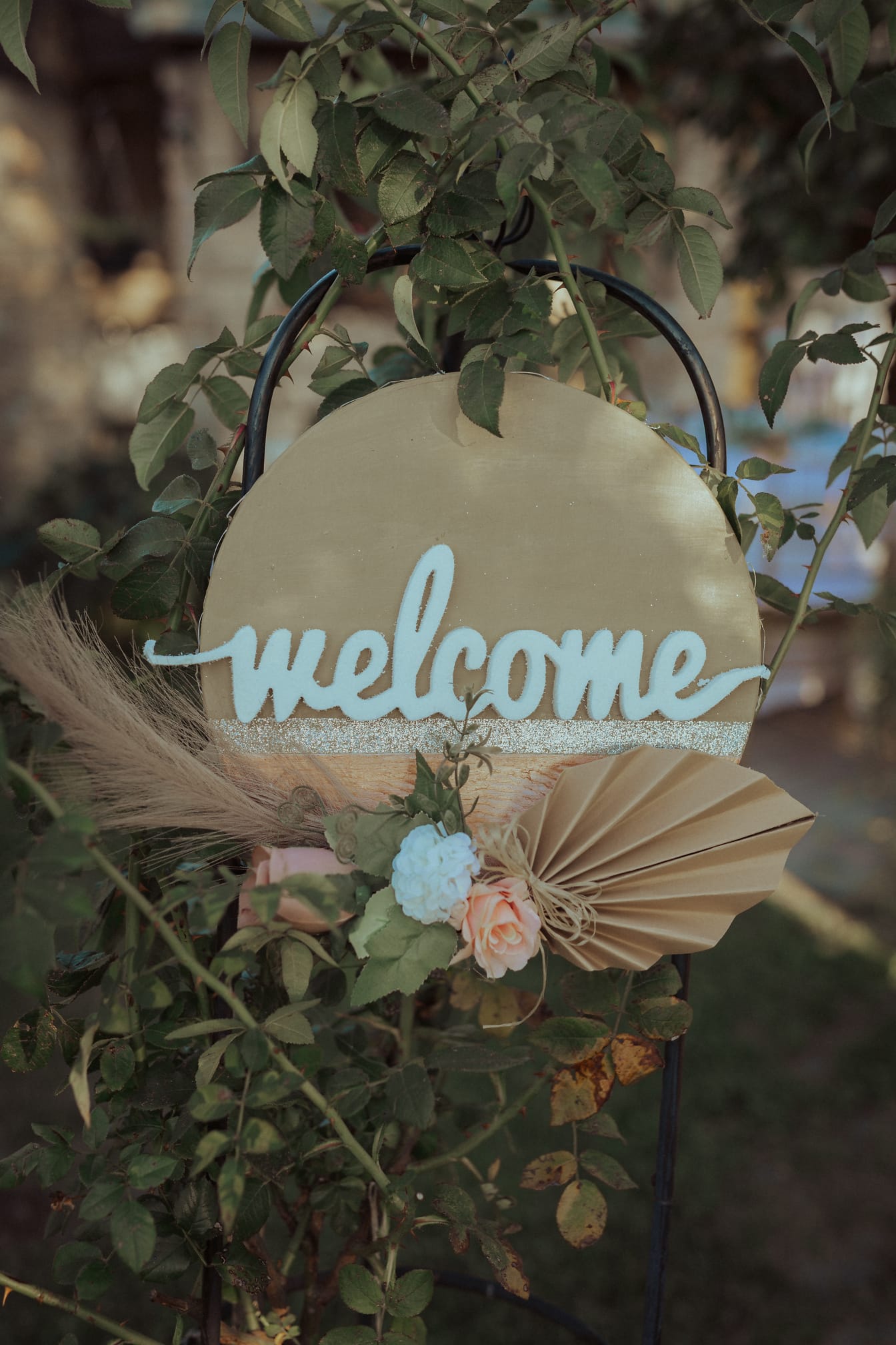 White welcome sign on metal chair arrangement decoration