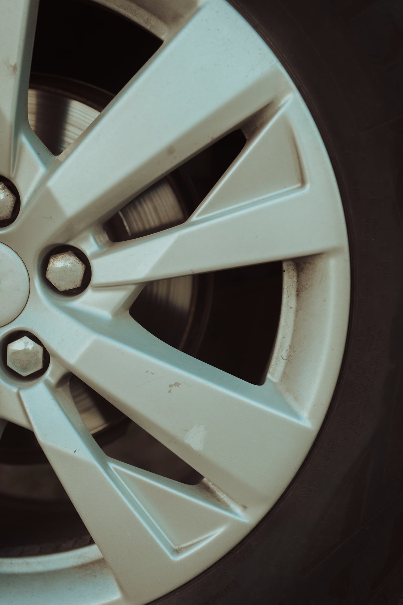 Half of aluminum wheel of sports car close-up