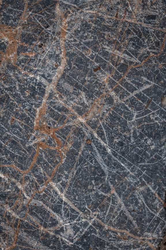 Textura close-up de pedra de granito com linhas marrons